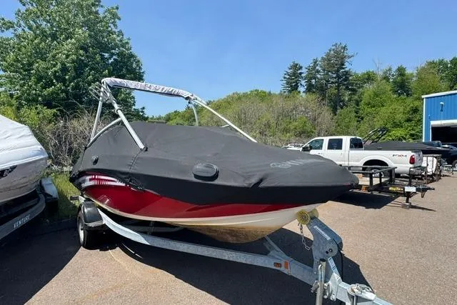 The Image of 2014 Yamaha AR192 boat on trailer, covered, parked outdoors. - 0