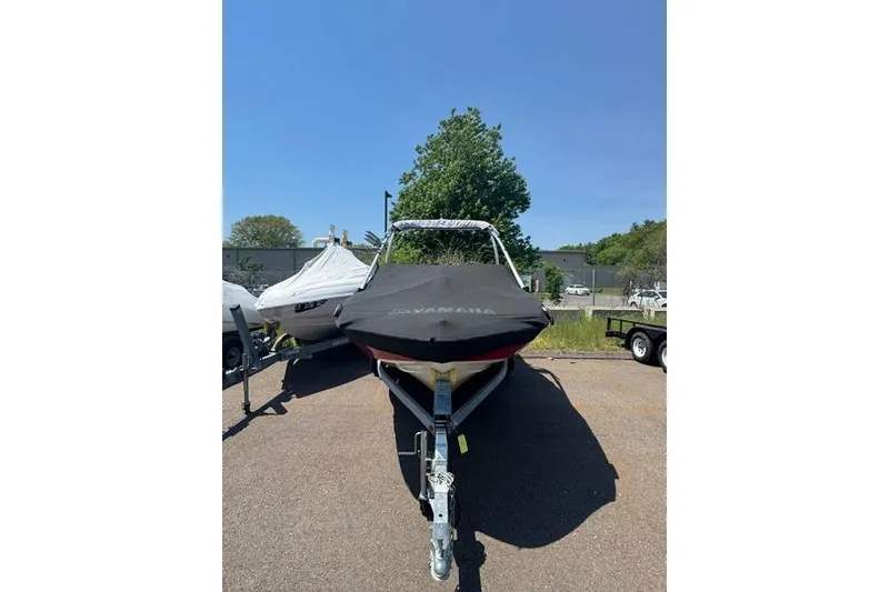 Slide: The Image of 2014 Yamaha Boats AR192 with cover on trailer, parked outdoors. - 1