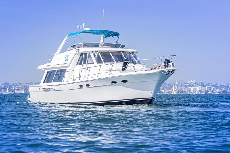 Slide: The Image of 2004 Meridian 490 Pilothouse yacht cruising on calm blue waters. - 1