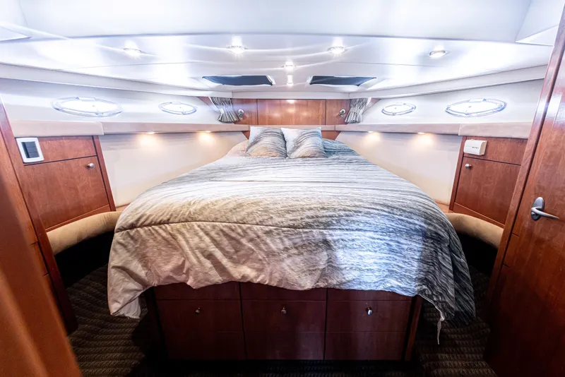 Slide: The Image of Luxurious bedroom interior of 2004 Meridian 490 Pilothouse yacht with cozy bedding. - 17