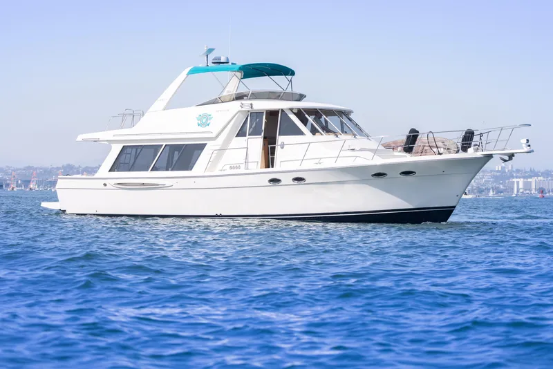 Slide: The Image of 2004 Meridian 490 Pilothouse yacht cruising on calm blue waters. - 2