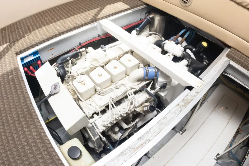 Slide: The Image of Engine compartment of a 2004 Meridian 490 Pilothouse yacht, showcasing mechanical components. - 24