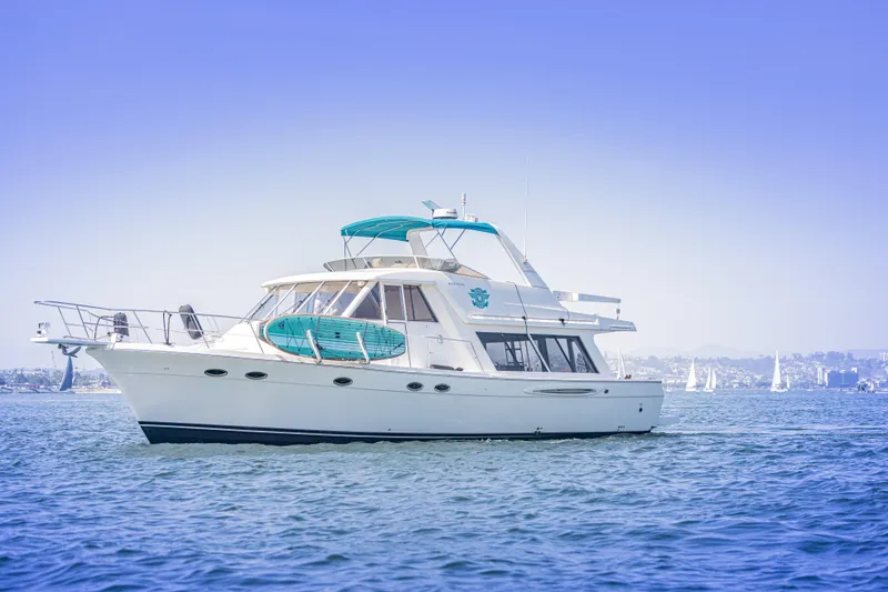 Slide: The Image of 2004 Meridian 490 Pilothouse yacht cruising on calm blue waters. - 8