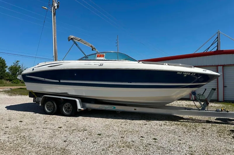 The Image of 2001 Monterey 248LS Montura Bowrider boat on trailer, for sale sign visible. - 1