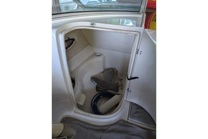 Slide: The Image of Interior storage compartment of 2001 Monterey 248LS Montura Bowrider boat. - 11