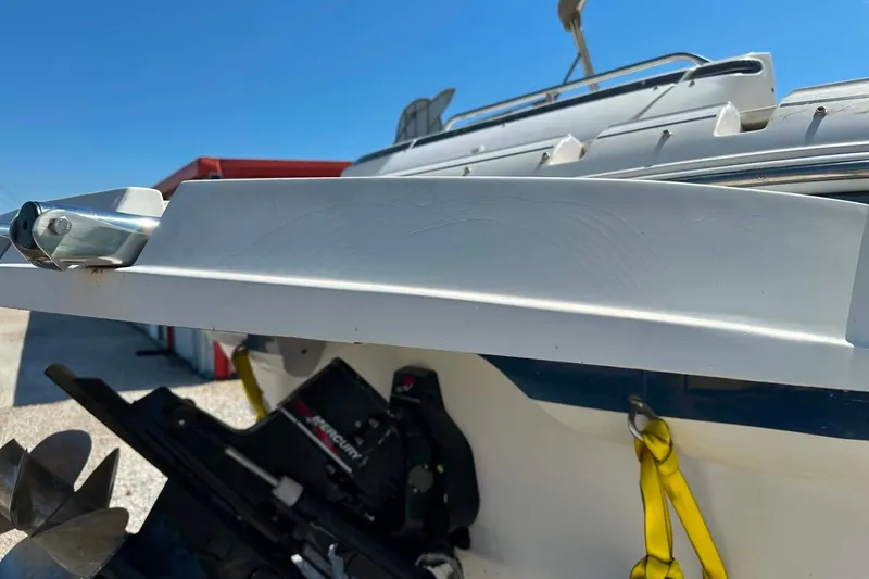 Slide: The Image of Rear view of a 2001 Monterey 248LS Montura Bowrider boat with visible propeller and hardware. - 6