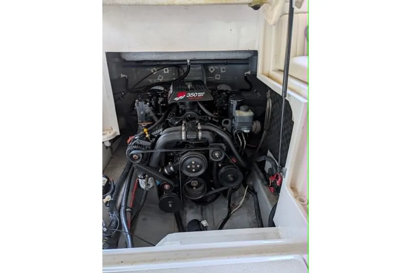 Slide: The Image of Engine compartment of a 2001 Monterey 248LS Montura Bowrider boat. - 9