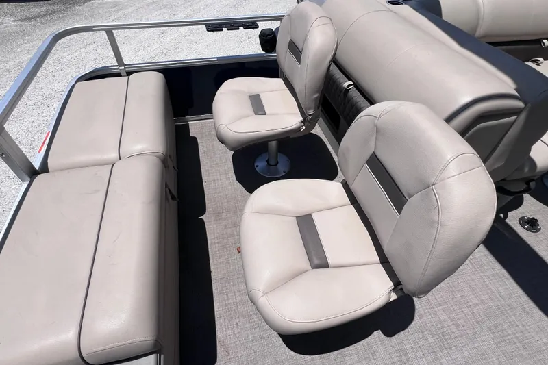 Slide: The Image of 2023 Sun Tracker Fishin' Barge 22 DLX interior with comfortable seating and spacious layout. - 14