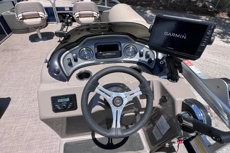 Slide: The Image of 2023 Sun Tracker Fishin' Barge 22 DLX dashboard with Garmin navigation system. - 22
