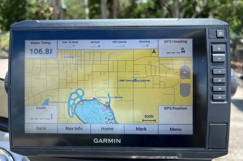 Slide: The Image of Garmin GPS displaying map and water temperature of 106.8°F on a 2023 Sun Tracker Fishin' Barge 22 DLX. - 26