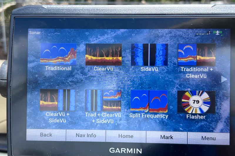Slide: The Image of Garmin sonar display on 2023 Sun Tracker Fishin' Barge 22 DLX, showing various sonar modes. - 27