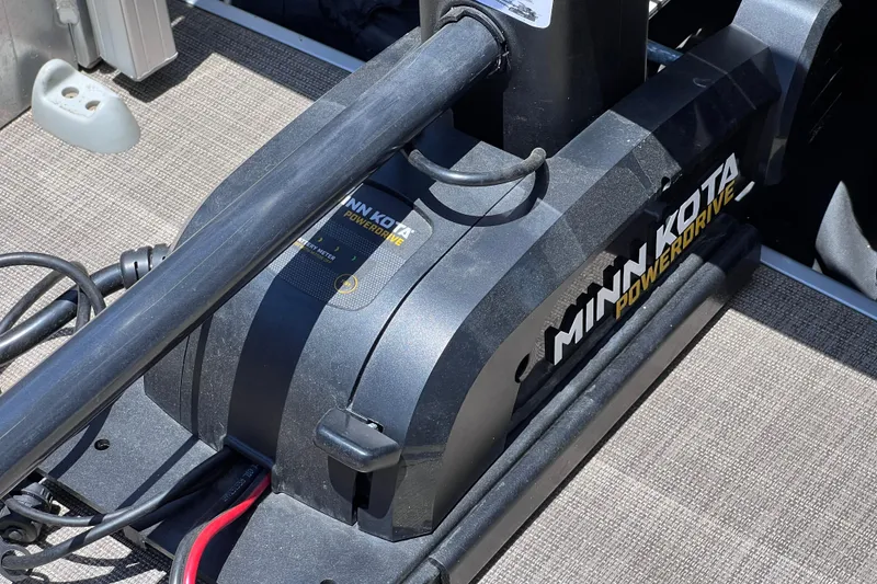 Slide: The Image of Minn Kota PowerDrive motor on 2023 Sun Tracker Fishin' Barge 22 DLX boat deck. - 31