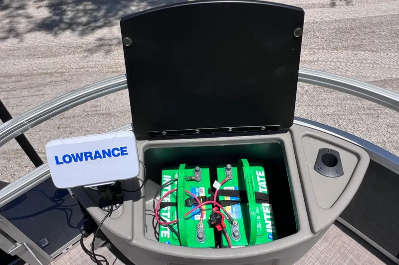 Slide: The Image of 2023 Sun Tracker Fishin' Barge 22 DLX with Lowrance electronics and battery compartment. - 34