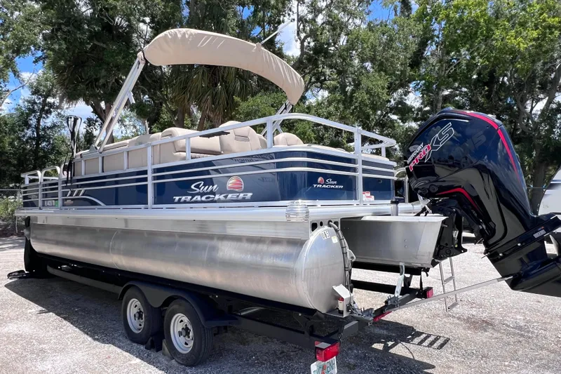 Slide: The Image of 2023 Sun Tracker Fishin' Barge 22 DLX pontoon boat with Mercury Pro XS engine. - 6