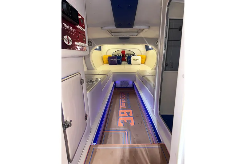 Slide: The Image of Interior of 2005 Cigarette 39 Top Gun Unlimited boat with modern design and ambient lighting. - 25