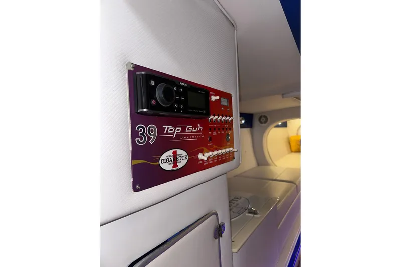 Slide: The Image of 2005 Cigarette 39 Top Gun Unlimited interior control panel with modern audio system. - 27
