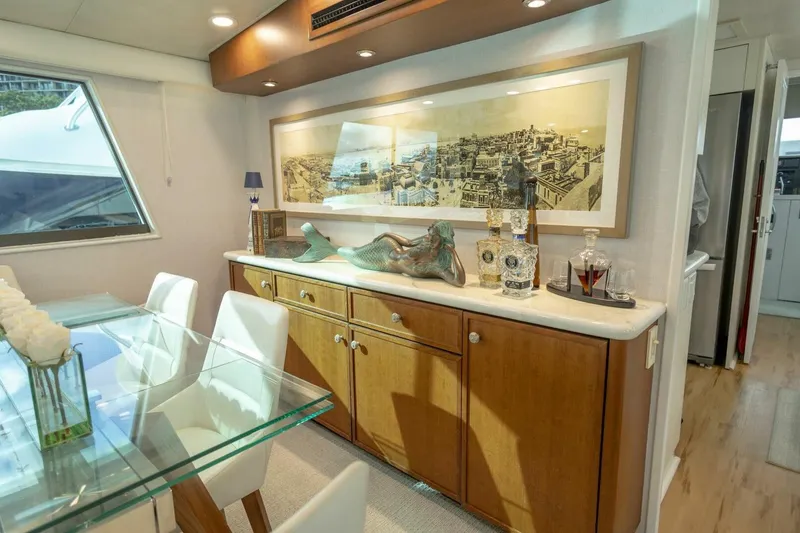 Slide: The Image of Luxurious 1989 Hatteras Custom Cockpit yacht interior with elegant dining area and decorative accents. - 14