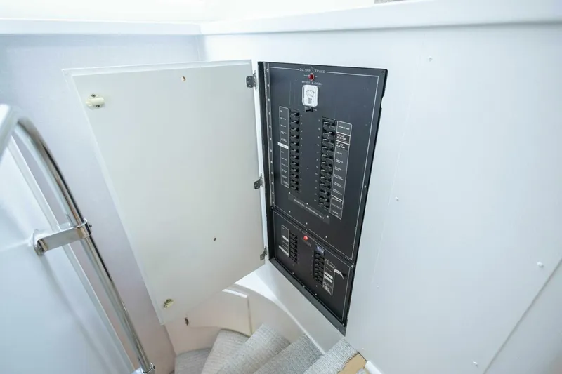 Slide: The Image of Electrical panel on 1989 Hatteras Custom Cockpit yacht, open door, stairway view. - 27