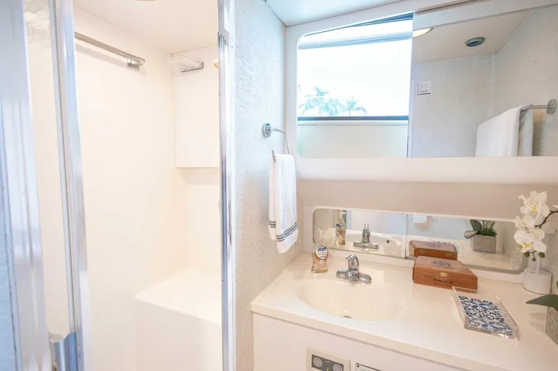 Slide: The Image of Luxurious bathroom in 1989 Hatteras Custom Cockpit yacht with modern fixtures and elegant decor. - 42