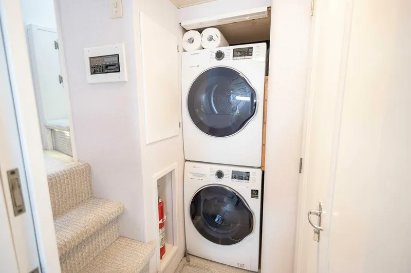 Slide: The Image of Stacked washer and dryer in 1989 Hatteras Custom Cockpit yacht interior. - 46