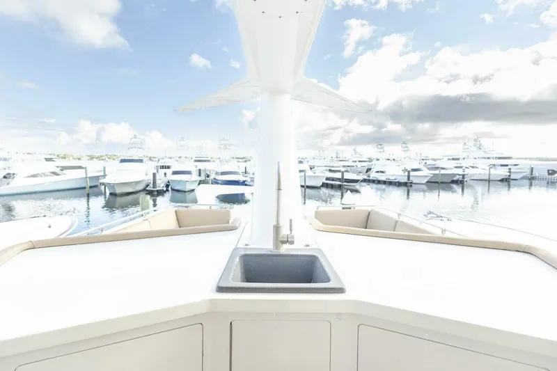 Slide: The Image of 1989 Hatteras Custom Cockpit yacht with marina view and onboard sink. - 56