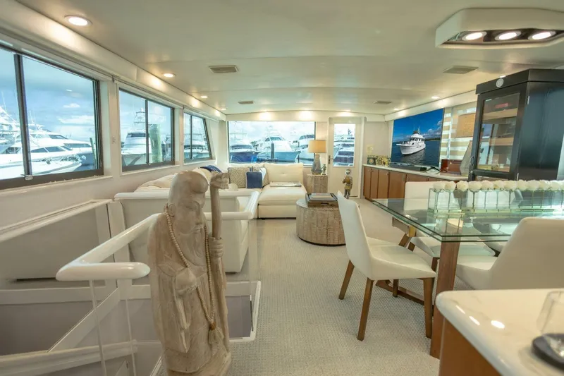 Slide: The Image of Luxurious interior of 1989 Hatteras Custom Cockpit yacht with elegant decor and large windows. - 9