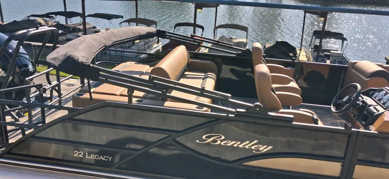 Slide: The Image of 2026 Bentley Pontoons Legacy 223 Swingback on the water. - 12