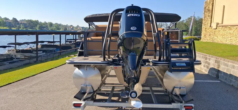 Slide: The Image of 2026 Bentley Pontoons Legacy 223 Swingback at dock with outboard motor. - 3