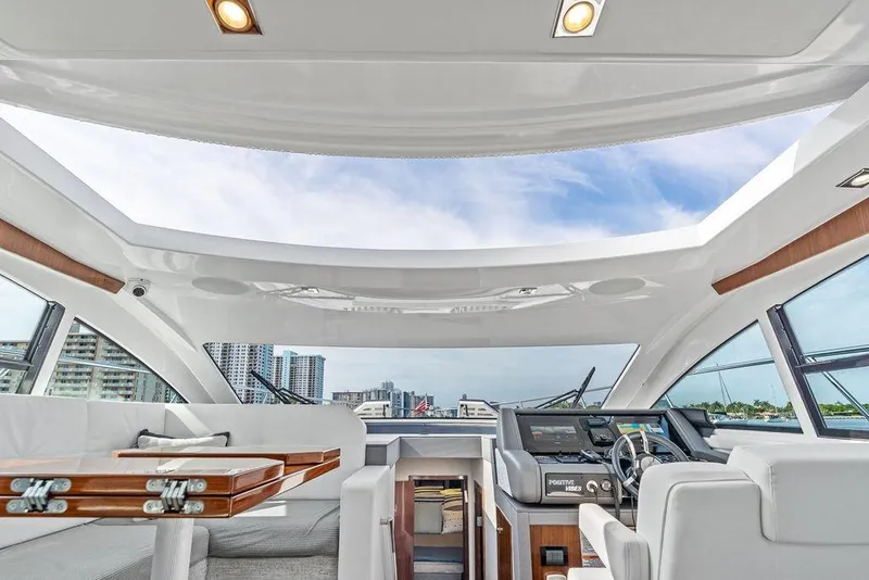 Slide: The Image of Interior view of 2022 Cruisers Yachts 46 Cantius with modern helm and seating. - 28