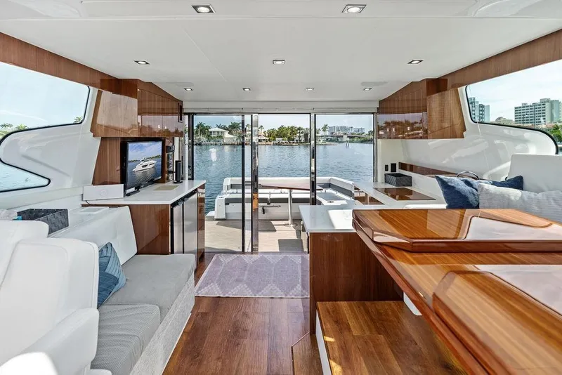 Slide: The Image of Luxurious interior of 2022 Cruisers Yachts 46 Cantius with waterfront view. - 33