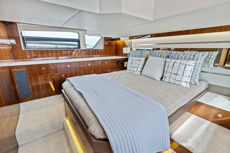 Slide: The Image of Luxurious bedroom interior of 2022 Cruisers Yachts 46 Cantius with elegant wood finish. - 43