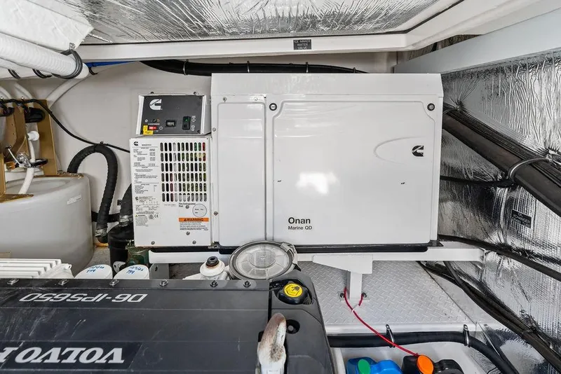Slide: The Image of Engine room of 2022 Cruisers Yachts 46 Cantius with Onan Marine QD generator. - 49