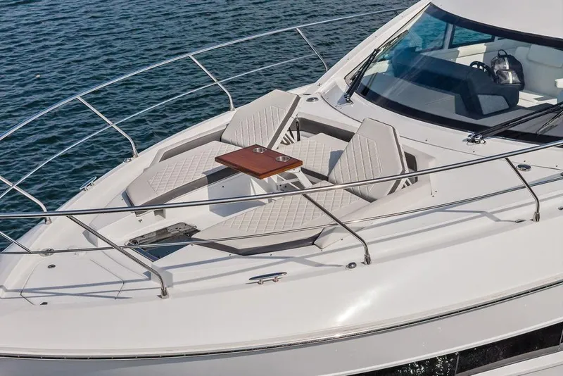 Slide: The Image of Luxurious 2022 Cruisers Yachts 46 Cantius with elegant deck seating on the water. - 5