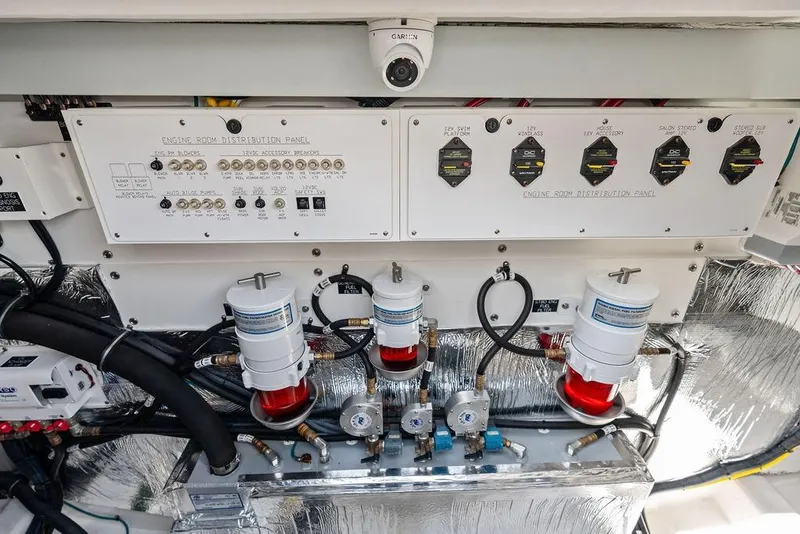 Slide: The Image of Engine room distribution panel of 2022 Cruisers Yachts 46 Cantius, showcasing control systems. - 50