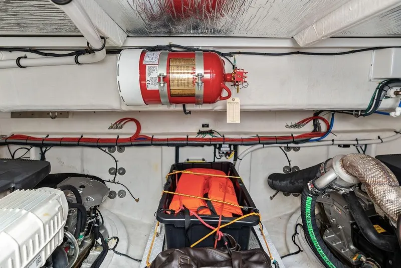 Slide: The Image of Engine room of 2022 Cruisers Yachts 46 Cantius with safety equipment and wiring. - 52