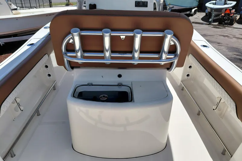 Slide: The Image of 2026 Pioneer 202 Sportfish boat interior with rod holders and seating. - 20