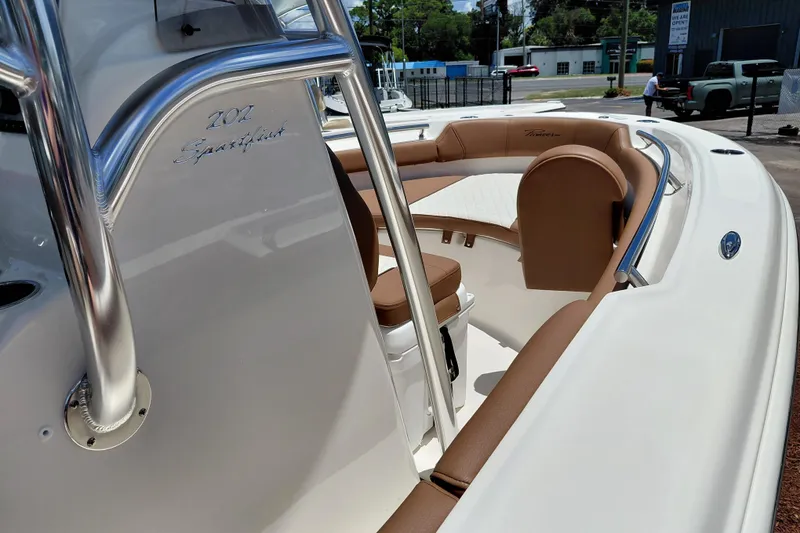 Slide: The Image of 2026 Pioneer 202 Sportfish boat interior with tan seating and sleek design. - 29