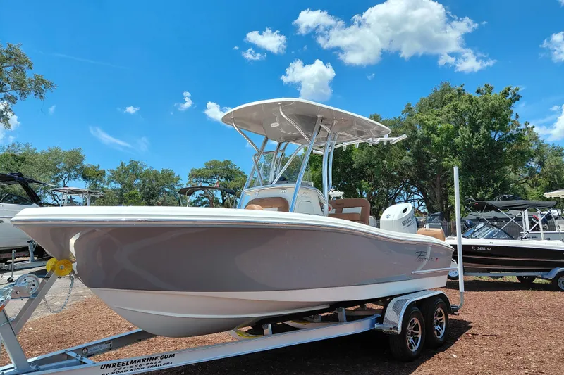 Slide: The Image of 2026 Pioneer 202 Sportfish boat on trailer under clear blue sky. - 3