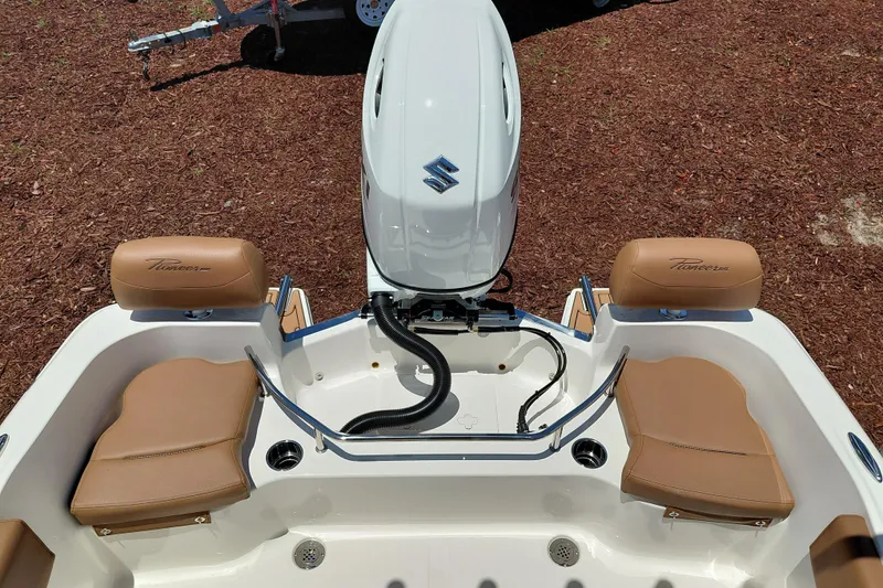 Slide: The Image of 2026 Pioneer 202 Sportfish boat with Suzuki engine and tan seating. - 30