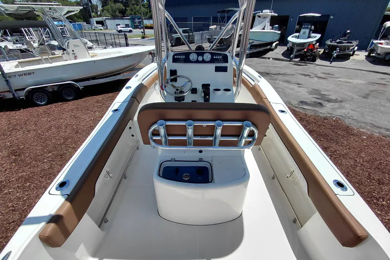 Slide: The Image of 2026 Pioneer 202 Sportfish boat interior with steering console and seating. - 36