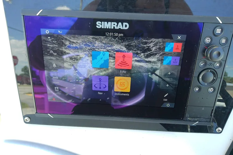 Slide: The Image of Simrad marine navigation system on a 2003 Wellcraft 250 Fisherman boat. - 21