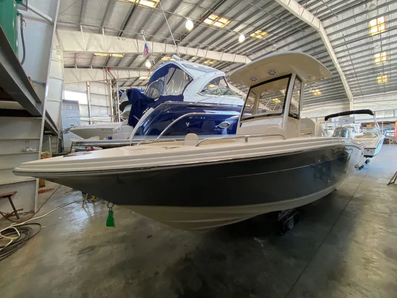 Slide: The Image of Scout 220 XSF 2026 boat in storage facility - 3