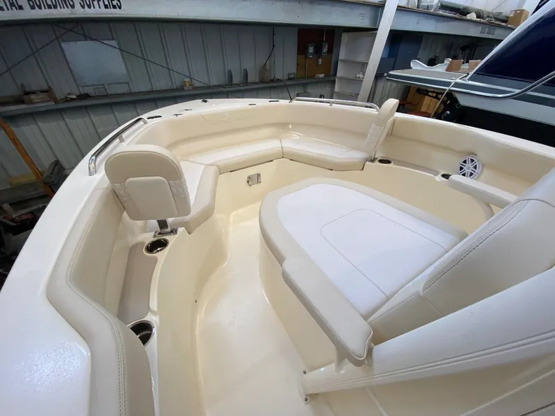 Slide: The Image of Interior of 2026 Scout 220 XSF boat with beige upholstery. - 8
