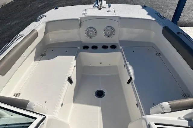 Slide: The Image of 2020 World Cat 230 DC boat interior with seating and storage compartments. - 3