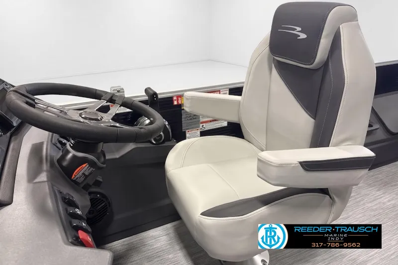 Slide: The Image of Captain's chair and steering wheel of 2026 Bennington 21 S1FC boat, featuring modern design. - 3