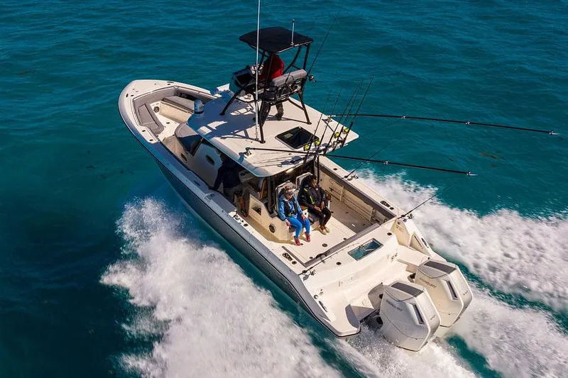 Slide: The Image of Manufacturer Provided Image: Boston Whaler 360 Outrage 2026 cruising on clear blue ocean waters. - 1