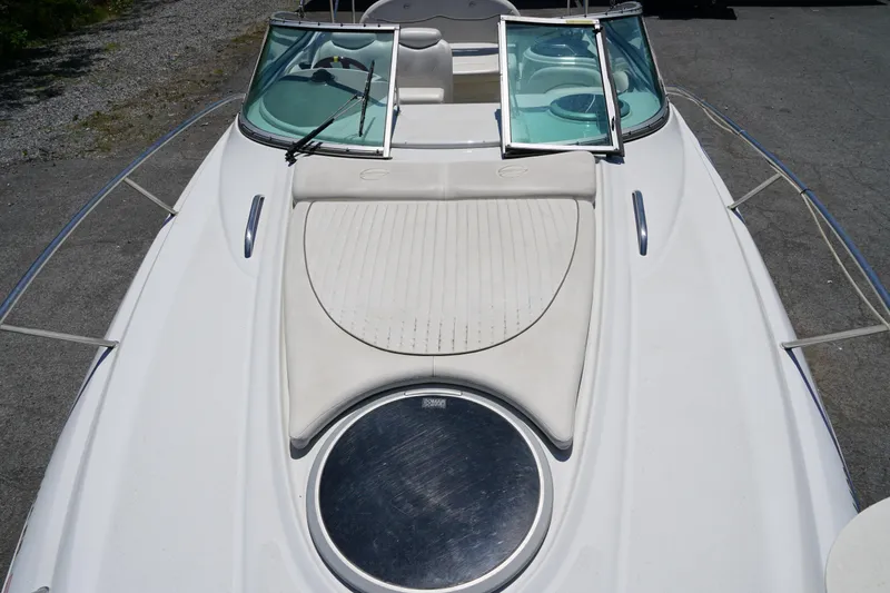 Slide: The Image of 2004 Crownline 250 CR boat deck with windshield and seating area. - 15