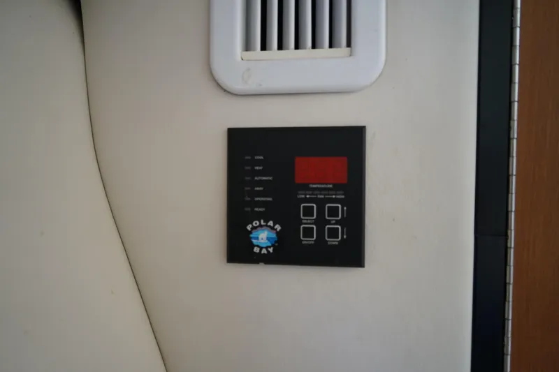 Slide: The Image of Control panel inside a 2004 Crownline 250 CR boat cabin. - 21