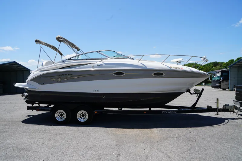 Slide: The Image of 2004 Crownline 250 CR boat on trailer under clear blue sky. - 4