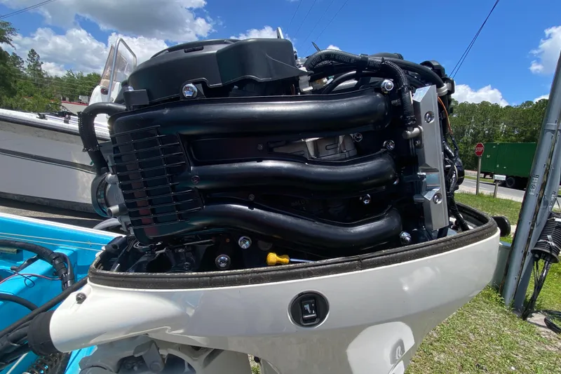 Slide: The Image of Close-up of a 1959 Boston Whaler 13 outboard motor, showcasing engine details. - 11